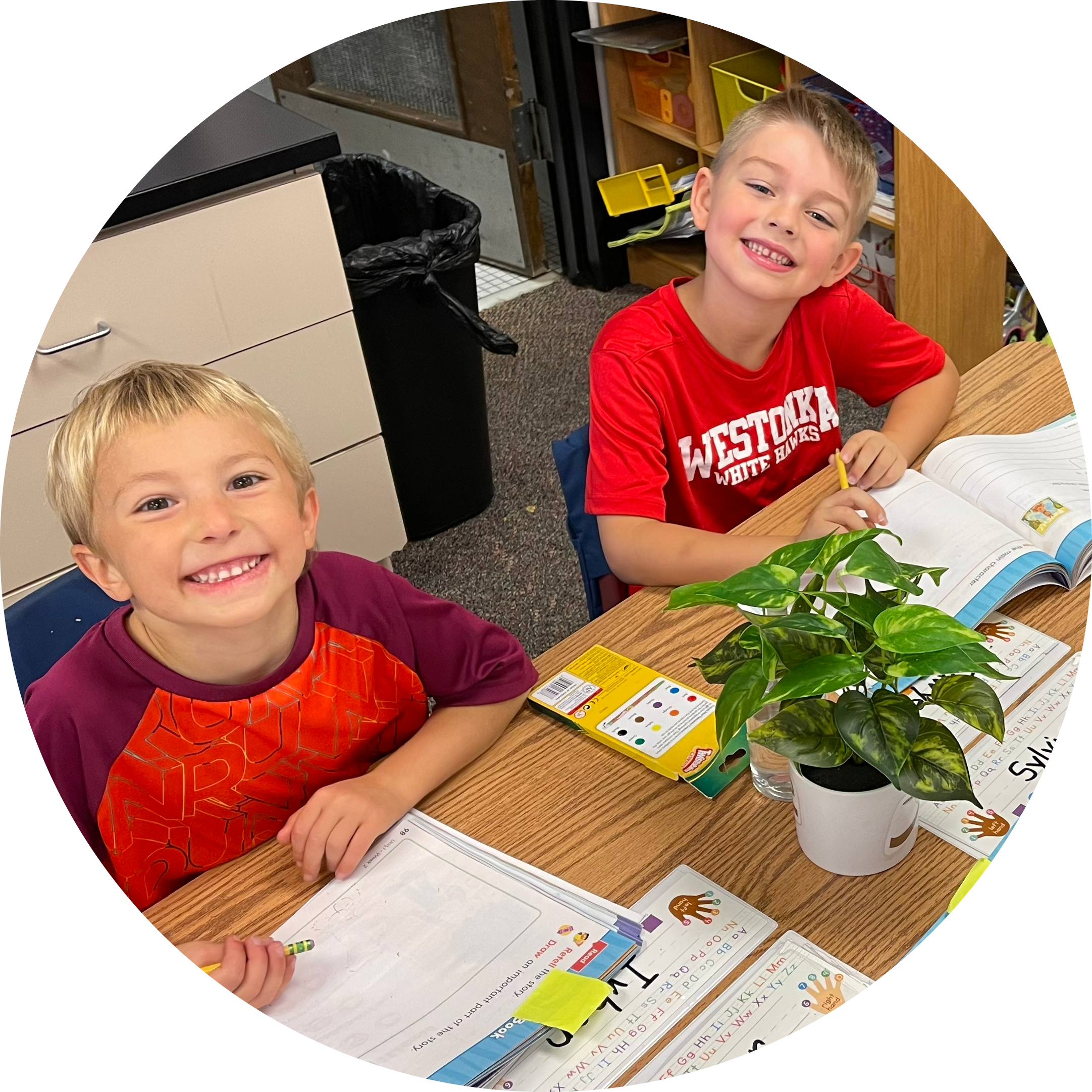 two elementary students smiling two elementary students smiling