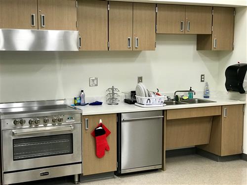 Kitchen with range, dishwasher and sink. 