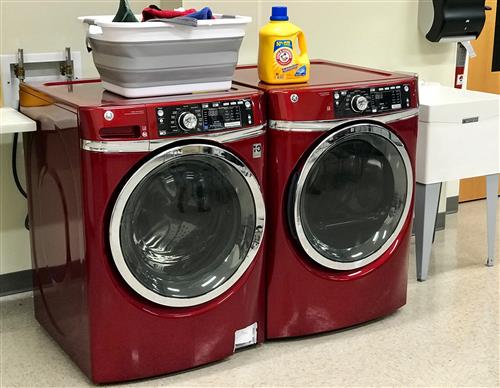 Washer and dryer with laundry basket. 