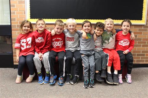 kindergarten students on a bench