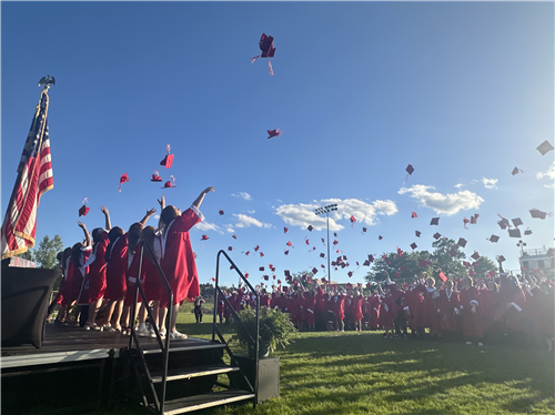 caps in the air at graduation